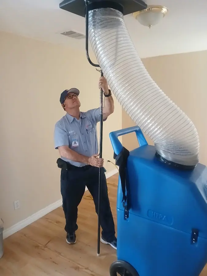 Furnace Tune-Up technician using HEPA equipment in Federal Way